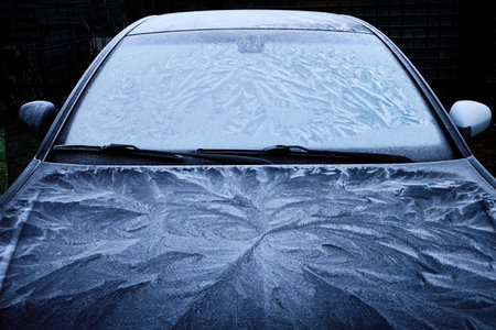 Frost Patterns on Car. A car covered in intricate frost patterns on a cold morning,の写真素材