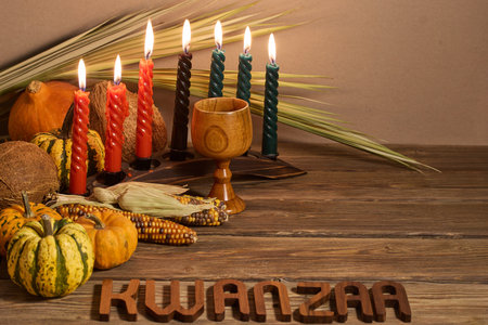 Kwanzaa Celebration Setup. A festive Kwanzaa display with candles, fruits, and decorative elementsの写真素材