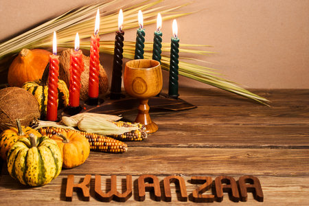 Kwanzaa Celebration Setup. A festive Kwanzaa display with candles, fruits, and decorative elementsの写真素材