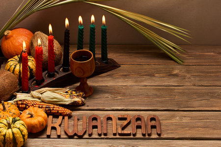 Kwanzaa Celebration Setup. A festive Kwanzaa display with candles, fruits, and decorative elementsの写真素材