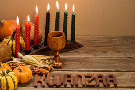 Kwanzaa Celebration Setup. A festive Kwanzaa display with candles, fruits, and decorative elementsの写真素材