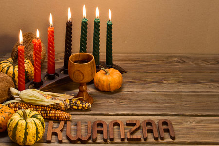 Kwanzaa Celebration Setup. A festive Kwanzaa display with candles, fruits, and decorative elementsの写真素材