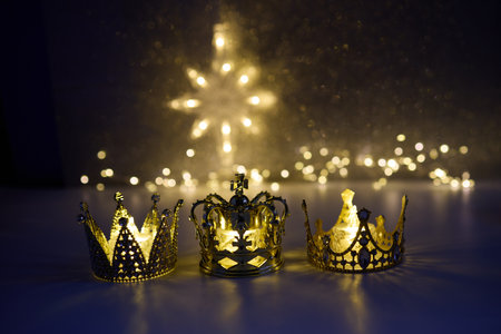 Epiphany. Golden Crowns and Lights. Three golden crowns with twinkling fairy lightsの写真素材