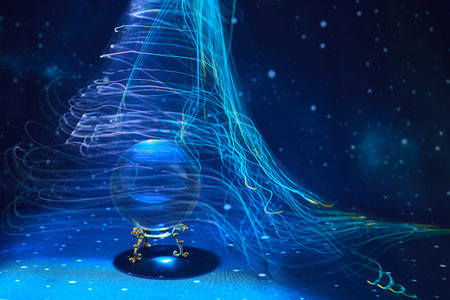 Ethereal Light Swirl. A crystal ball surrounded by swirling blue and white light trails