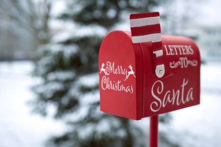 Santas Mailbox in Snowy Scene. Red mailbox for letters to Santa, set in a snowy winter backgroundの写真素材