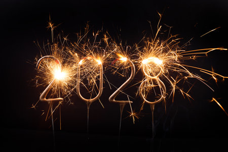 Sparkling 2028 Celebration. Bright sparklers form the numbers 2028 on a dark backgroundの写真素材