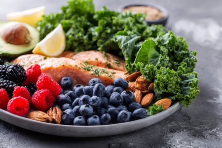 Healthy keto diet plate with salmon, berries, greens, nutsの素材
