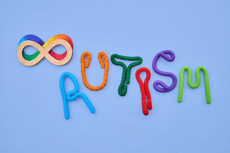Autism neurodiversity infinity symbol with colorful pop tube letters