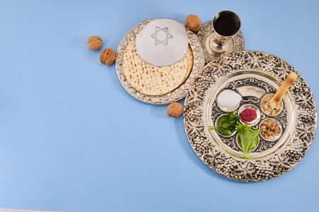 Passover seder plate with matzah, kippah and wine