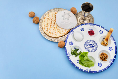 Traditional passover seder plate with matzah and kippah