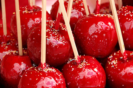 Sweet candy apples covered with colorful sprinklesの写真素材