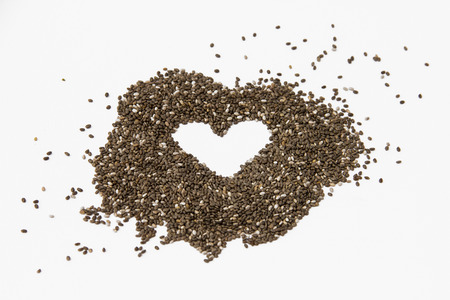 Chia seeds isolated on a white background forming a heart.の写真素材