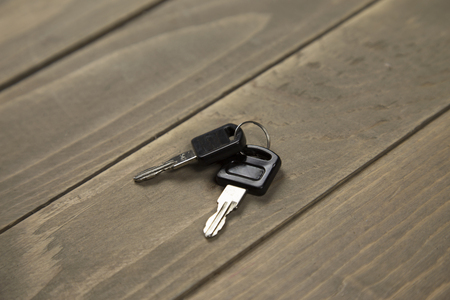 Studio shot of Two key on wood backgroundの写真素材