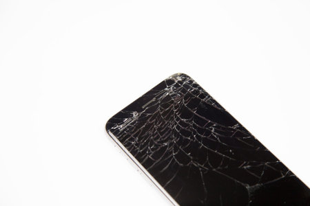 broken cell phone isolatedの写真素材