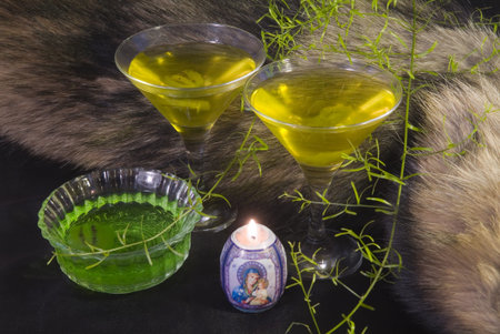 Glasses with a cocktail on the background of fur