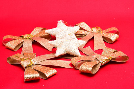 Christmas tree decorations, holiday ribbons, stars on a red background, decoration, design