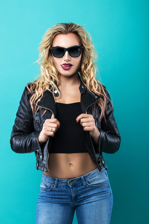 Sexy blonde in a black leather jacketの写真素材