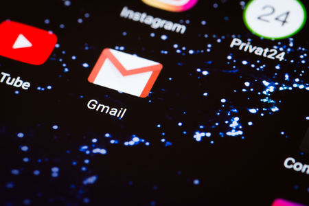 Kiev, Ukraine - October 3, 2017: the Gmail logo on the smartphone screen close-up.のeditorial素材