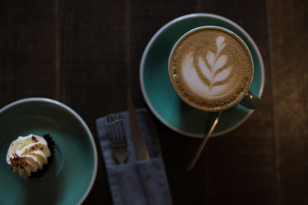 Cappuccino on a wooden table. The cake. View from above.の写真素材