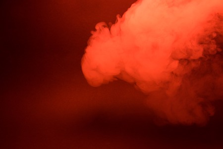 Colorful smoke close-up on a black backgroundの写真素材