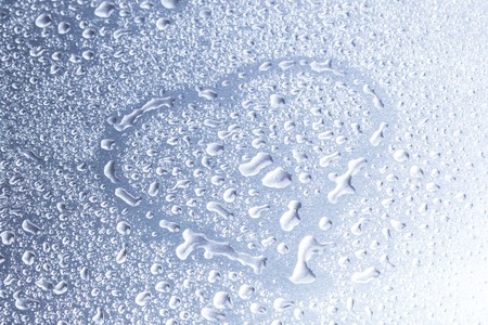 Drops of water on a gray background closeupの写真素材