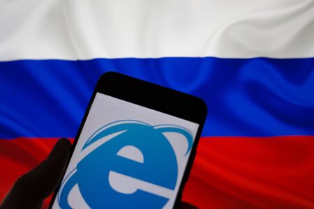 Kiev, Ukraine - April 12, 2019: Smartphone in hand without internet connection on the background of the Russian flagのeditorial素材