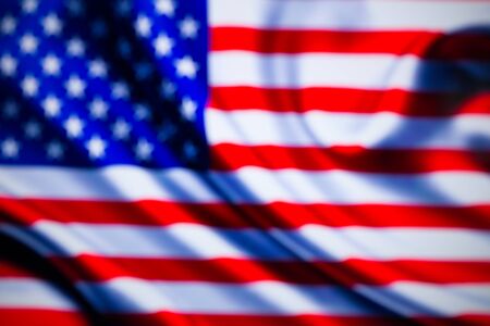 Blurred US flag close up. Developing in the wind.の写真素材