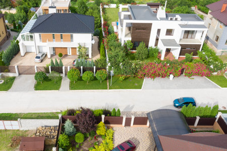 Air filming with drone. Quarter with houses and parked cars.の写真素材