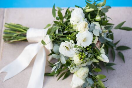 Wedding bridal bouquet on a blue background close-up.の写真素材