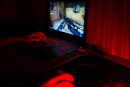 Kiev, Ukraine - June 12, 2019: Red backlit keyboard close up. Gaming laptop.のeditorial素材
