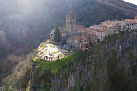 The ancient city on the cliff. Aerial photography from a drone. Beautiful sunset with rays.