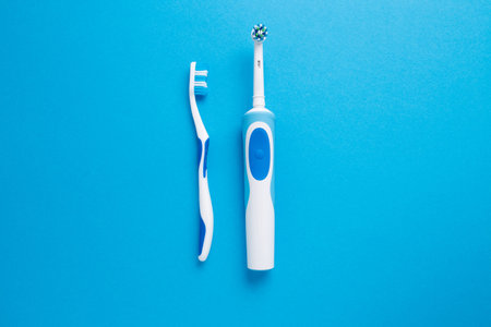 Electric or simple toothbrush on a blue background.