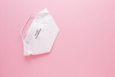 White medical mask on a pink background. Virus protection. Covid19の写真素材