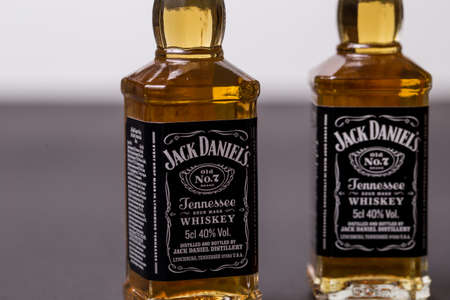 Kiev, Ukraine - June 12, 2019: Jack Daniel's whiskey bottle. 50 ml souvenir bottle on a black background.のeditorial素材