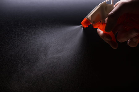 Spray with a water jet close-up on a black background