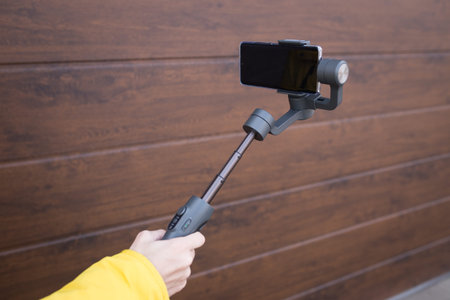 Mobile image stabilizer for smartphones on a white isolated background.