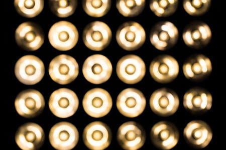 Blurry vintage lamps. Vintage incandescent bulbs in retro style. Many lights in the form of a spotlight.の写真素材