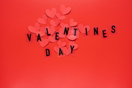 Valentines day words and hearts on red background. Valentines Day 14 February.の写真素材