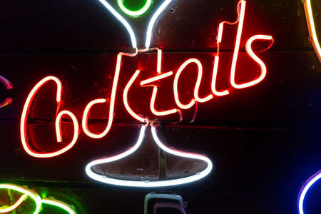 Neon assorted shapes on a black wall. Glowing multi-colored neon.の写真素材