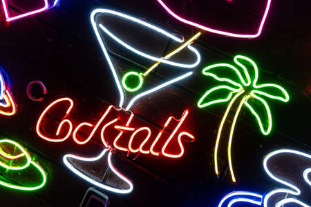 Neon assorted shapes on a black wall. Glowing multi-colored neon.の写真素材