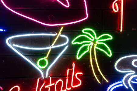 Neon assorted shapes on a black wall. Glowing multi-colored neon.の写真素材