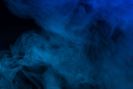 Colorful smoke close-up on a black backgroundの写真素材