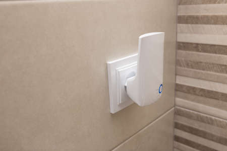 Wifi home repeater plugged in closeup.の写真素材