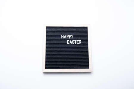 Happy easter. Text on a black background.の写真素材