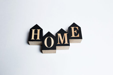 Decorative letters forming the word HOME on a white backgroundの写真素材
