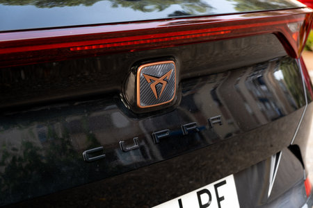 Tarragona, Spain - June 01, 2022: The Seat Cupra logo on a car in black close-up.のeditorial素材