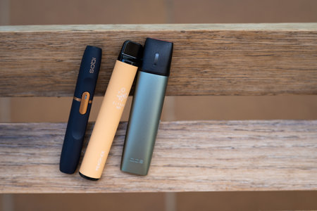 Tarragona, Spain - September 16, 2022: Electronic cigarettes IQOS close-up. Different options for smoking and cigarette. Choice of devices for the use of nicotine.のeditorial素材