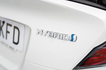 Tarragona, Spain - October 29, 2022: Hybrid designation on a carのeditorial素材