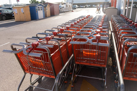 Tarragona, Spain - June 01, 2022: row of shopping trolleys or carts in supermarket