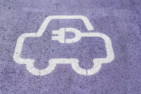 Parking for electric vehicles in purple on the asphalt.の写真素材